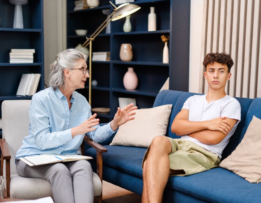 Counselor discussing with a teenager.