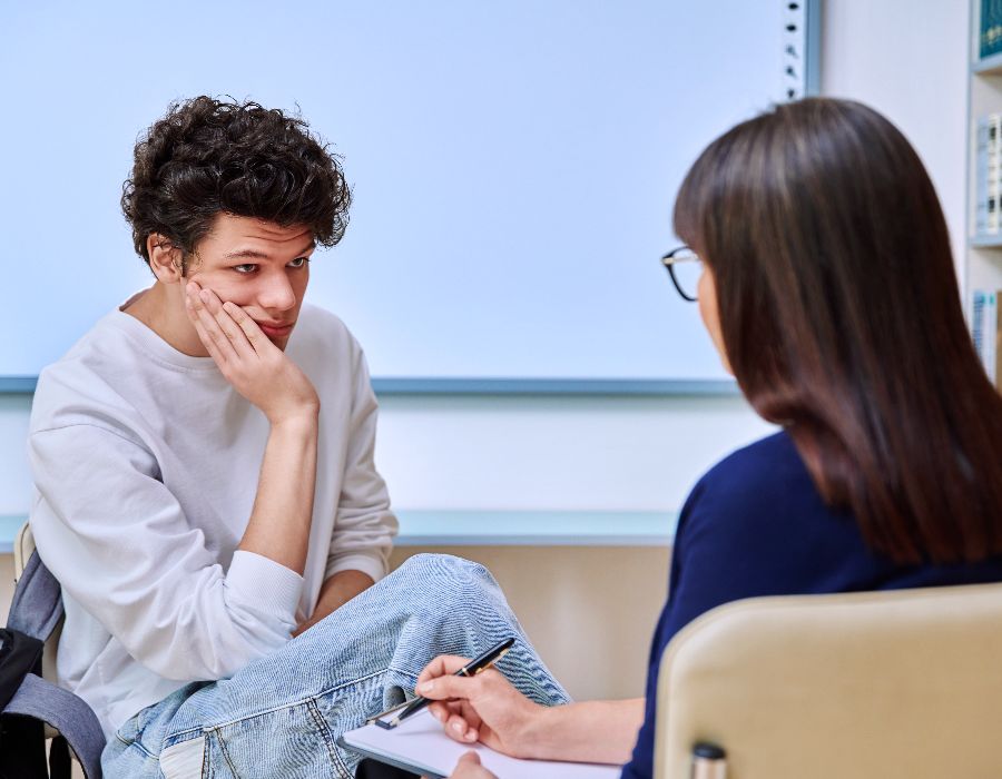 Young man in counseling session.