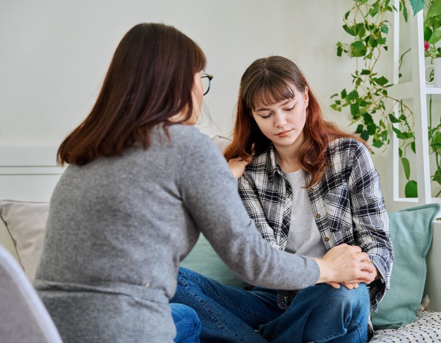 Two people in a supportive conversation.