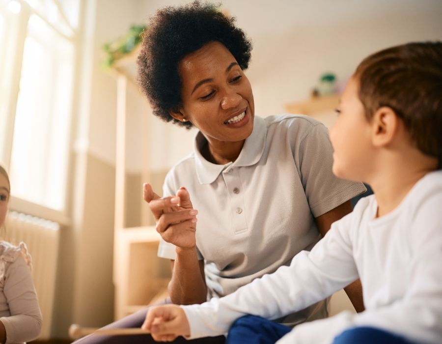 Teacher engaging with young children