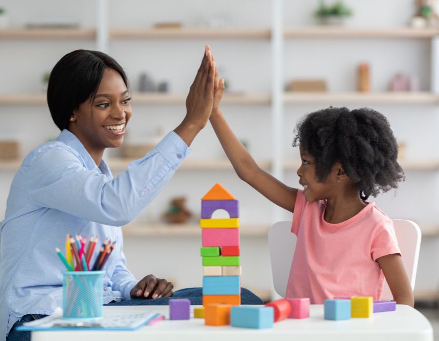 Mother and daughter playing with blocks