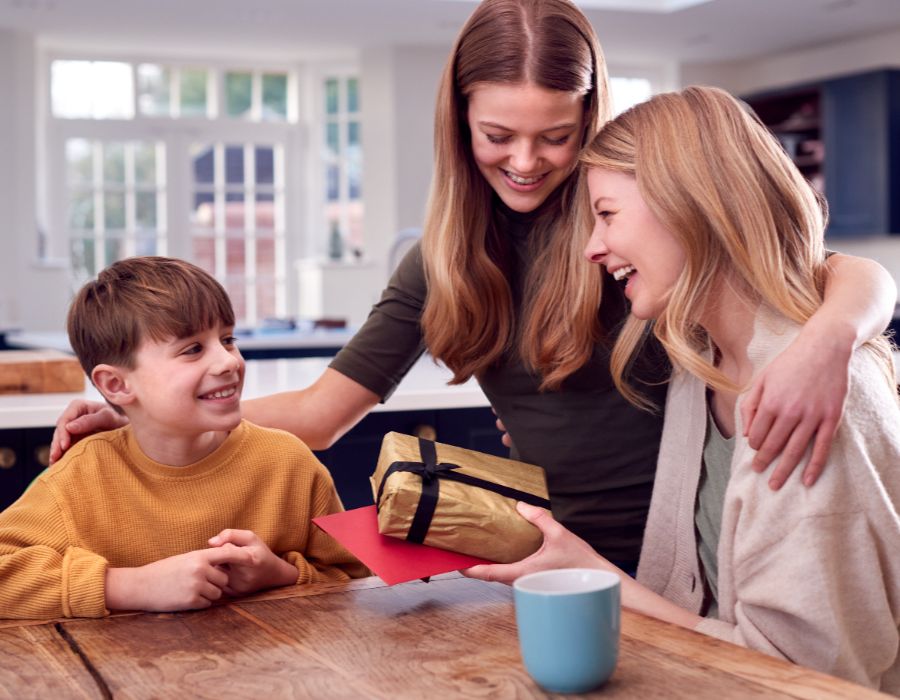 Family celebrating with a gift.