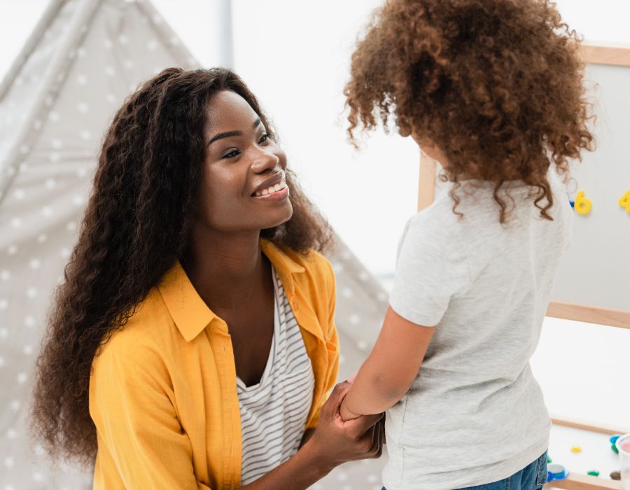 Woman interacting with young child