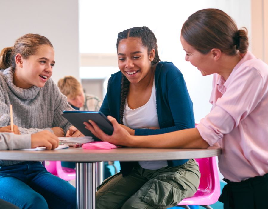 Group of students collaborating with tablet