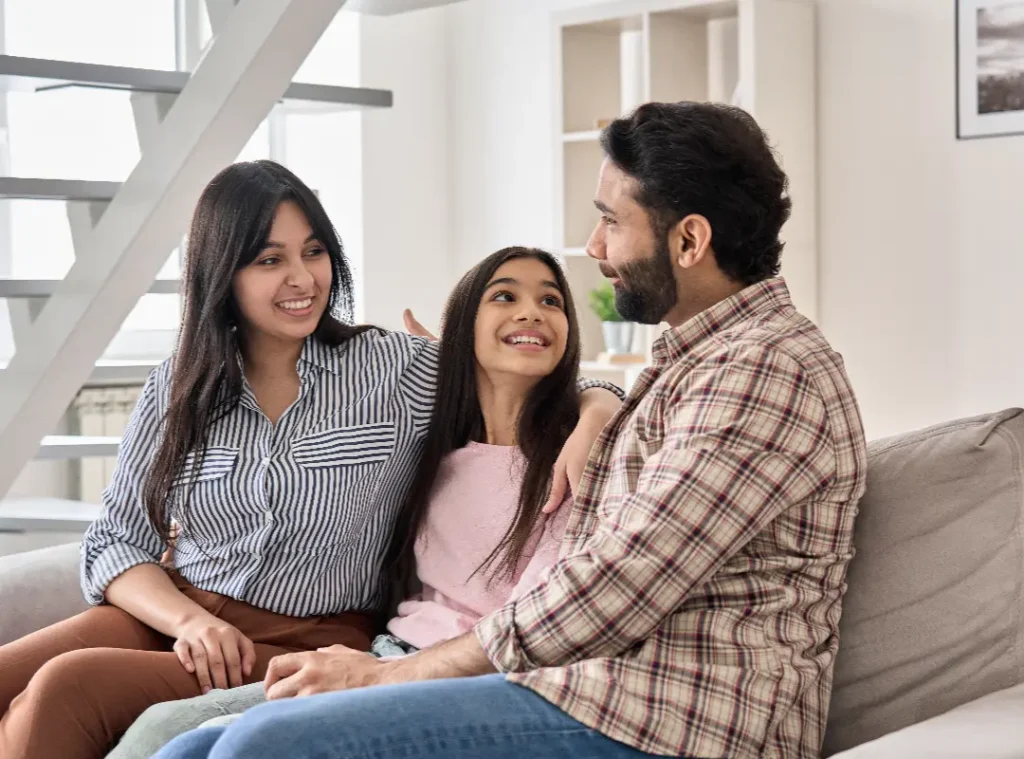 Family enjoying time together on couch.